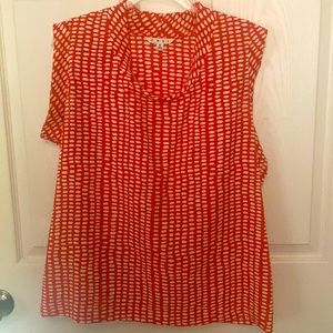 Cabi Madeline blouse in orange and white abstract print. Size M.